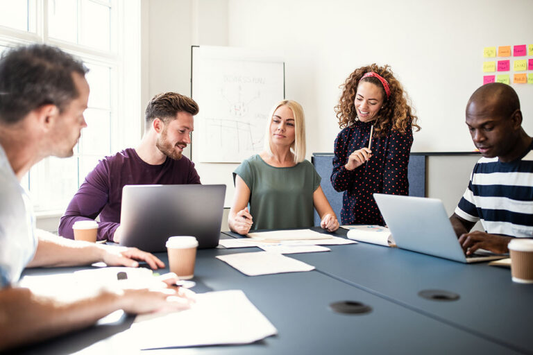 Professional team working together on copywriting and content in a meeting