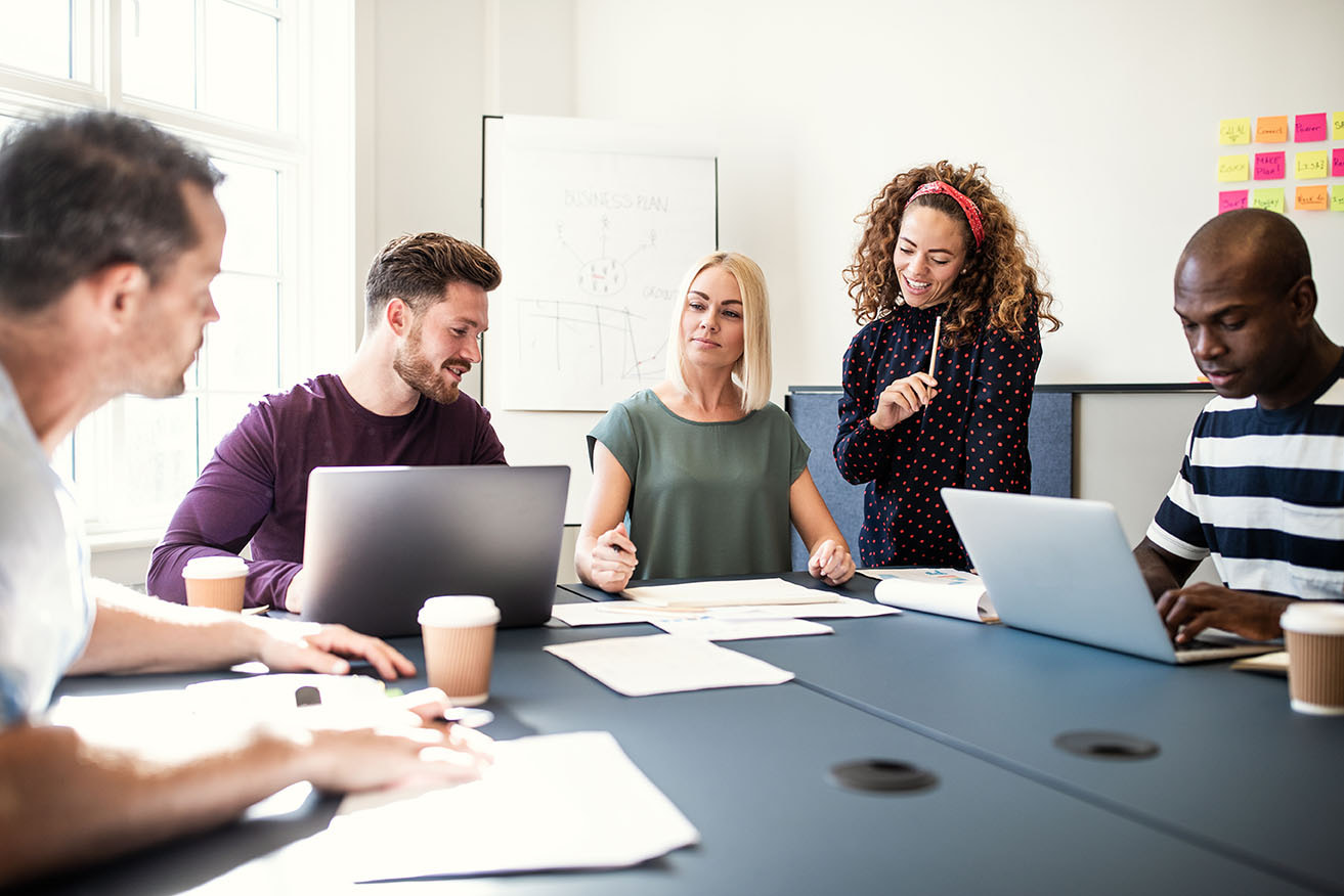 Professional team working together on copywriting and content in a meeting