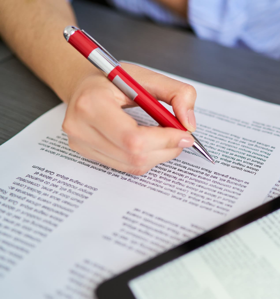 Proofreading corporate documents and reports with pen and tablet