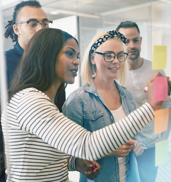 Team brainstorming with colourful sticky notes in a modern office